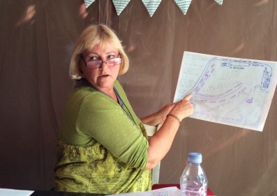 Permaculture design course student showing her design